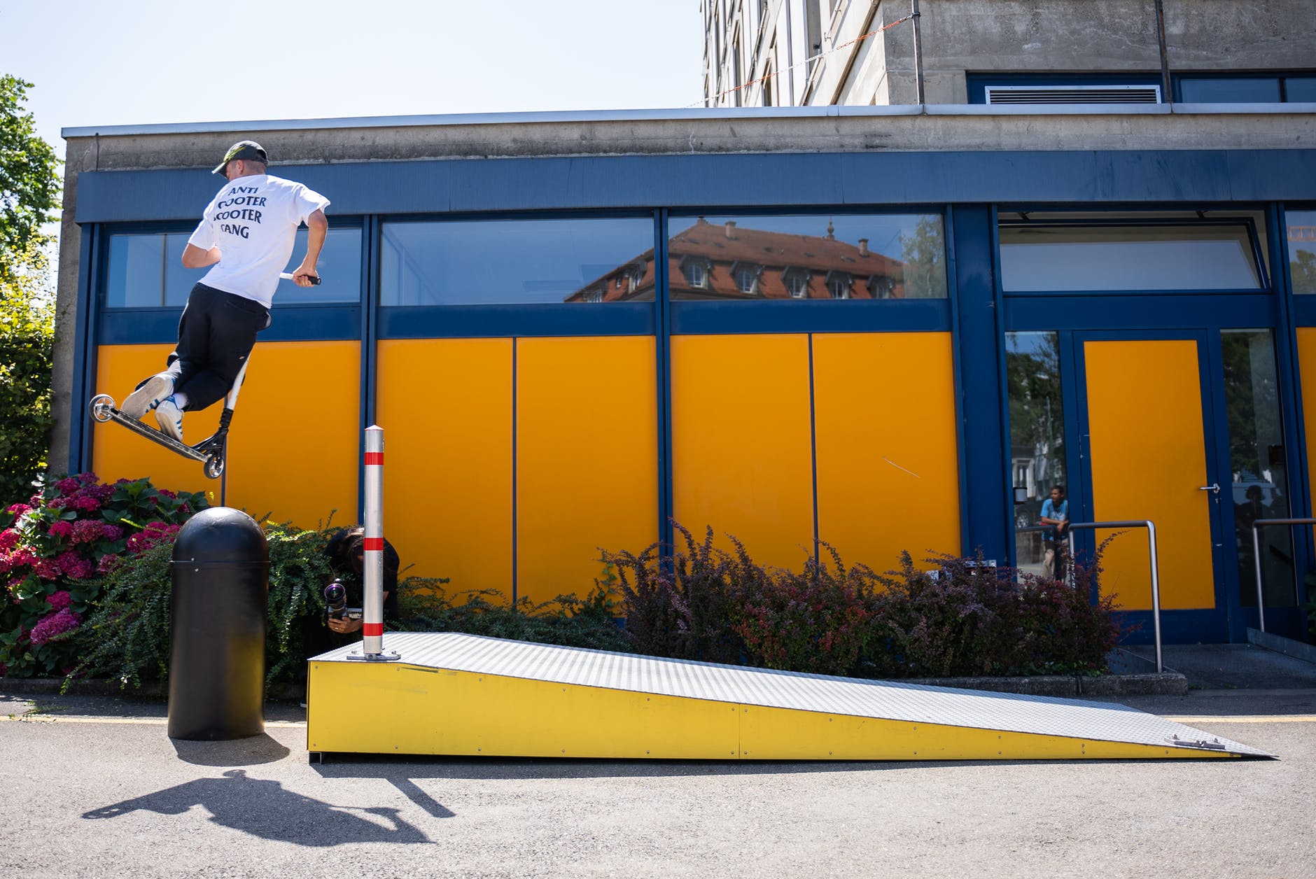 man on a kick scooter doing a stunt